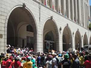 And today, a block away, the demonstrations continue in front of the Provincial legislature. Amandla! Awethu! 
